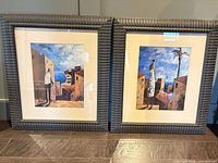 Both framed prints side by side showing frames and mats