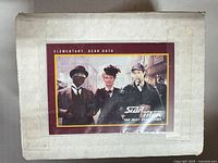 White cardboard box with episode card "Elementary, Dear Data" affixed to lid