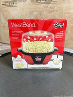 Retail box of WestBend Stir Crazy 6 Qt Stirring Popcorn Machine