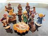Group of ceramic nativity figurines displayed