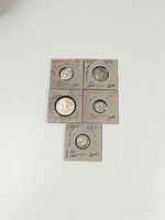 All five coins in holders