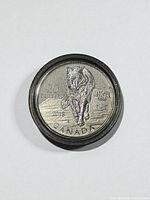 Reverse of coin with wolf design, $20, 2013, Canada
