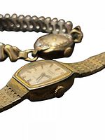 Bulova and Cardinal watches showing faces and bracelets