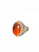 Front view showing amber cabochon and gilt filigree