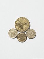 Reverse sides, showing quartered shields on florin, patterned designs on 10-denomination coins and imperial eagle on 5 kopeks