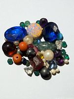 Group of assorted loose gemstones on white background