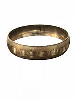 Full view of sterling silver bangle showing exterior wave pattern