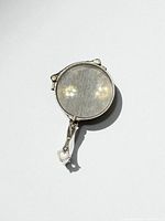 Lorgnette folded, front view showing round lenses and handle