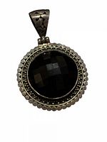Front view of sterling silver pendant showing faceted onyx and beaded edge