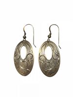 Front view of both sterling silver oval floral earrings