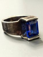 Ring front angle showing blue stone in bezel