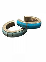 Two sterling silver hoop earrings with turquoise inlay