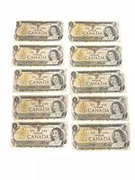 All ten Canadian $1 banknotes laid out