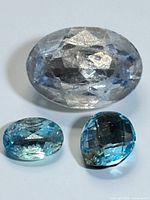 All three faceted topaz gemstones displayed together