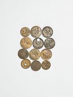 Thirteen assorted foreign coins front view