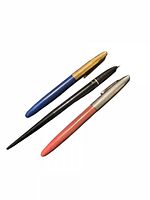 Three vintage fountain pens laid side by side showing full length and colours