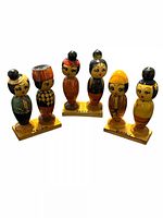 Front view of all three doll pairs