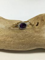 Front view of ring showing amethyst and diamond halo