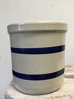 Front view of stoneware jar showing two cobalt bands