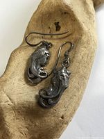 Front view of both earrings showing design detail