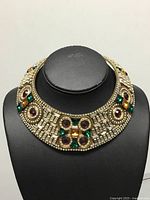 Front view of brass collar necklace on display bust