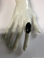 Ring on display hand showing size and design