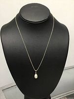 Necklace displayed on bust showing overall appearance