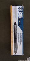 Front view of boxed Belson Pro brush iron
