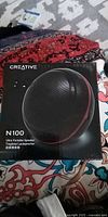 Front of box showing Creative N100 speaker image and model info