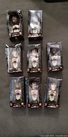 Seven boxed Giants bobbleheads arranged face up