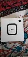 Front of sealed smartwatch box showing square watch graphic