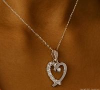 Pendant on neck with chain (chain not part of lot) showing size and appearance