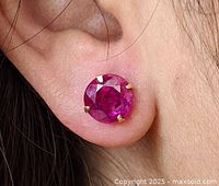 Earring worn in ear showing size and color