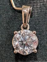 Front view of pendant showing round lab diamond in four-prong 10K setting