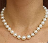 Pearl necklace worn to show length and pearl size