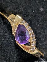 Top view showing pear-shaped amethyst and accent stones