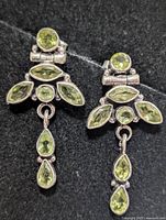Front view showing peridot arrangement and silver setting
