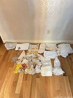 Full lot spread showing doilies, small purses, and ornamental pieces