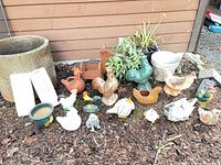 Group shot of all garden ornaments, planters, deer holder, birdhouse, dog statue