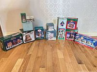 Full lot showing all boxed village pieces on floor