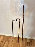 Front view of three canes standing side by side