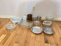 All bakeware items laid out on floor showing overall lot