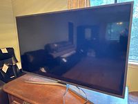 Front view of Samsung 50-inch TV on stand