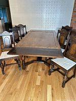 Dining table with six chairs, angled view