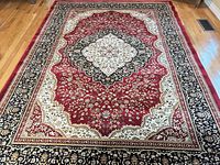 Full view of rug showing pattern and borders