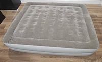 Top view of inflated queen air mattress showing flocked surface