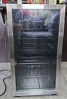 Front view showing glass door and stainless frame