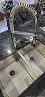 Faucet and double-bowl sink installed in countertop