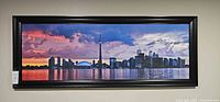 Front view of framed Toronto skyline print on wall