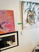 All three artworks hanging together on wall